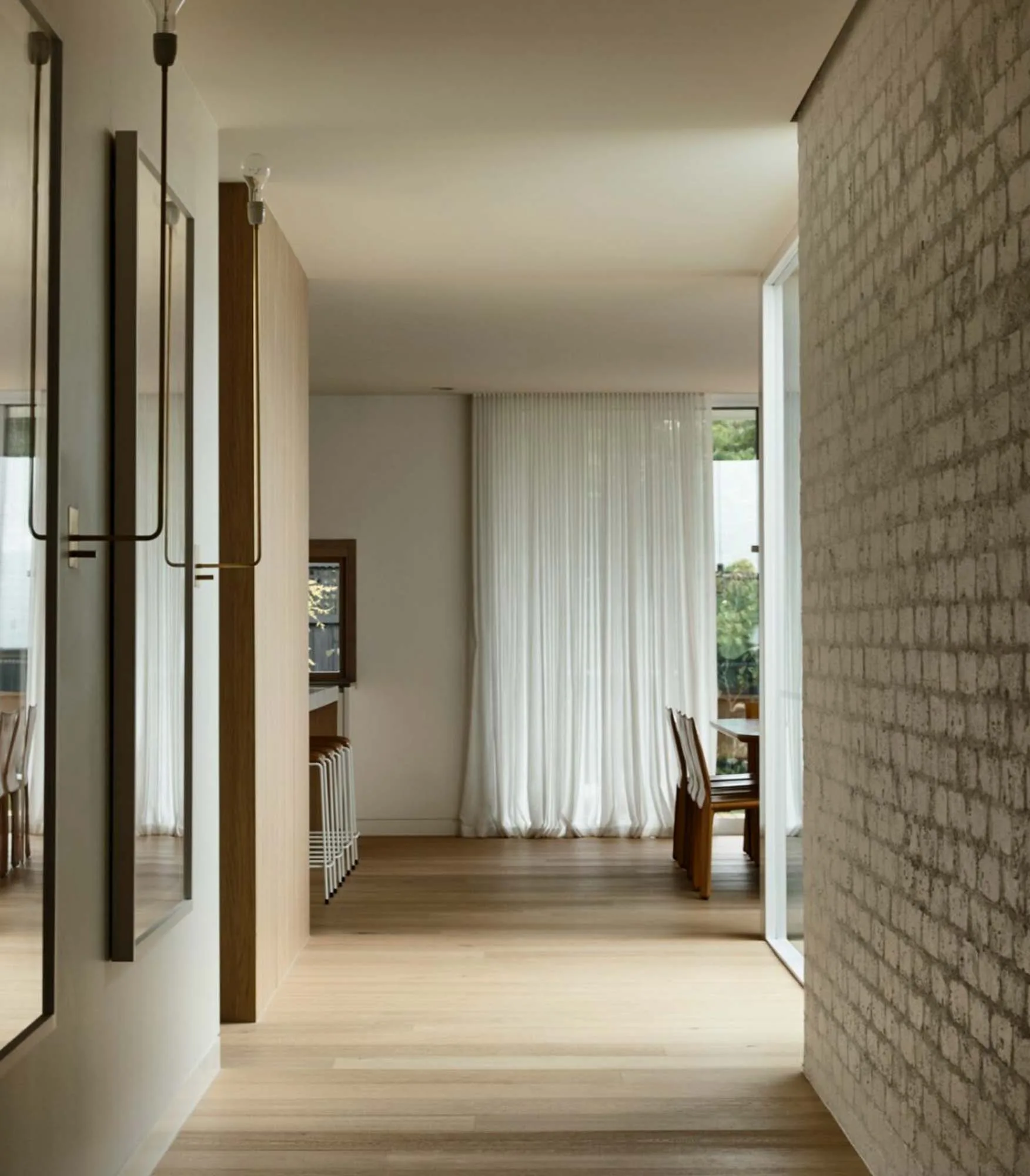 Brighton East Garden House — Hallway with pale brick and timber flooring