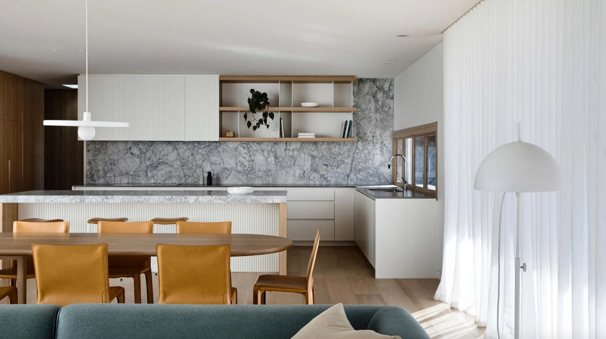 Brighton East Garden House — Kitchen island and dining area